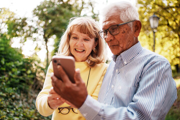 Joyful and Memorable Moments Shared Seniors Engaging with Technology in the Great Outdoors