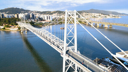 Panoramic aerial view of the Herc&iacute;lio Luz Bridge and the central region of the capital city of Florian&oacute;polis, Santa Catarina, Brazil, on a sunny summer day

