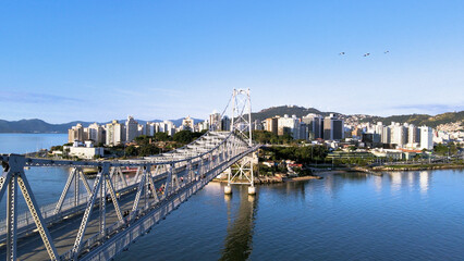 Panoramic aerial view of the Herc&iacute;lio Luz Bridge and the central region of the capital city of Florian&oacute;polis, Santa Catarina, Brazil, on a sunny summer day
