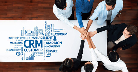 A diverse group of professionals engaging in a collaborative strategy meeting focused on customer...