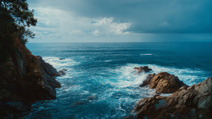 Blue ocean waves under clear sky with scenic outdoor coastal view