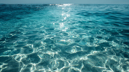 Gentle waves creating abstract patterns on water surface in sunlight