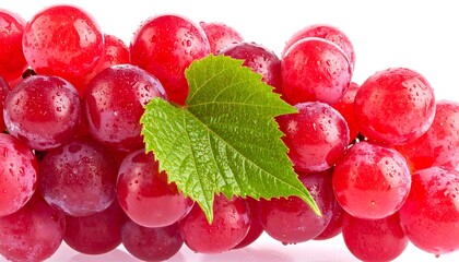 Close-up of a bunch of red grapes with a green leaf