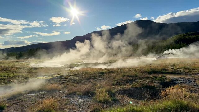 Ground Level Pan of Steaming Geothermal Hot Springs Near Geysir Iceland