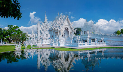 Panorama White temple wat rong khun reflecting in pond, Chiang Rai, travel landmark of Thailand