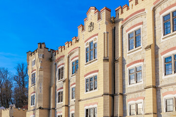 Historic european castle with blue sky background in architectural detail