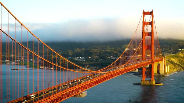 Golden gate bridge in san francisco, california, with fog rolling in at sunrise