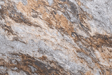 Obraz premium Swirling stone texture in beige brown and grey hues natural pattern background