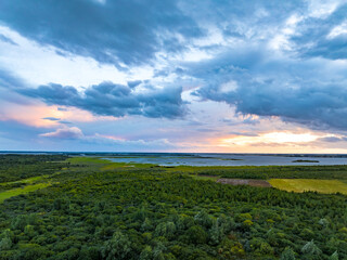 Fototapeta premium Landscape of The Dutch Coastside in Sunset Hours, Lauwersoog The Netherlands