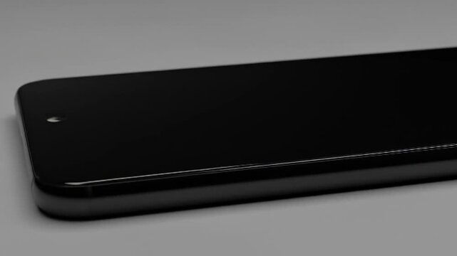 Sleek black smartphone, angled view, showcasing curved edges and minimal bezel