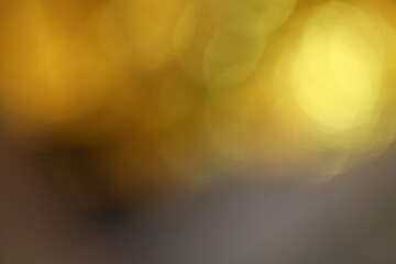 Abstract blur soft focus blinking light gold, brown grain gradient background. Light and shadow smoke refraction.