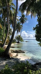 Lush tropical shoreline with swaying palm trees and tranquil turquoise water.