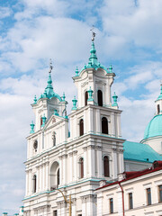 Fototapeta premium St. Francis Xavier Catholic Cathedral in Grodno, Belarus on a partly cloudy afternoon - portrait shot