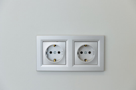 Modern electrical outlets on a clean wall showcasing minimalist design aesthetics