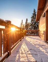 Snowy wooden deck at sunset