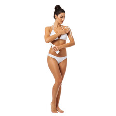 Woman applying sunscreen lotion for sun protection and skin care in white bikini on transparent background