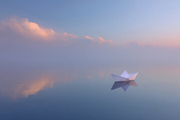 Fototapeta premium delicate paper sailboat floats gently on tranquil puddle reflecting sky above