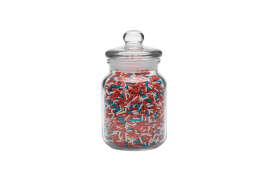 A glass jar with a lid filled with red, white, and blue sprinkles. background removed