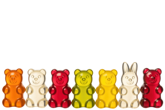 A row of colorful gummy bears and a gummy bunny on a transparent background. background removed
