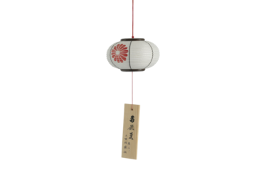 A charming Japanese wind chime featuring a miniature white lantern with a red chrysanthemum design and a wooden tag. background removed