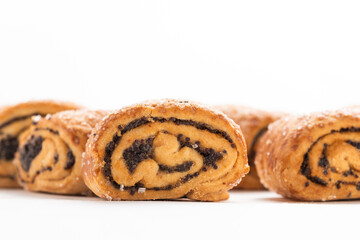 Poppy seed strudel isolated on white background.