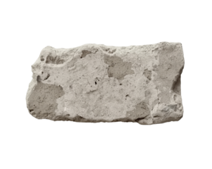 Close up shot of a weathered brick fragment isolated on a contrasting background, capturing its intricate texture