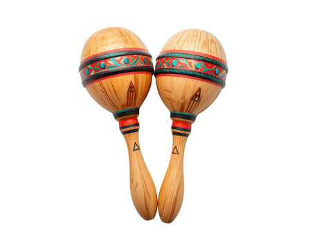 Closeup of handcrafted wooden maracas with tribal style geometric decorations on a simple backdrop