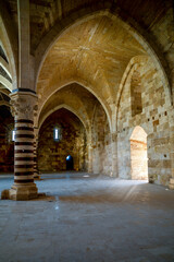 Exploring historical architecture in  Castello Maniace, historic coastal fortress in Syracuse, Sicily, Italy structure in the heart of Italy during daylight