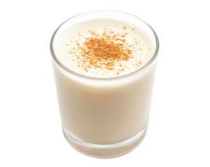 Eye Level Close-Up Glass of Coquito Beverage Sprinkled with Cinnamon for Holiday Celebrations