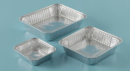 Three shiny aluminum foil containers on light blue background