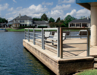 benches at waters edge protected by metal fence