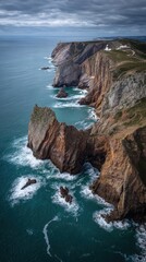 Majestic coastal cliffs meet the ocean at sunset