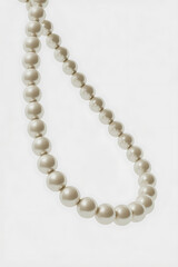 Fototapeta premium Elegant pearl necklace with round beads. 