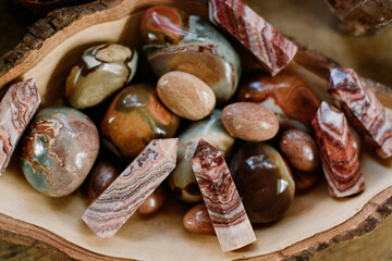 Natural crystal collection with earthy tones in wooden bowl