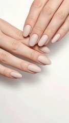 Naklejka premium Matte almond nude manicure. Simple yet sophisticated nail design for stylish and modern everyday women’s looks.
