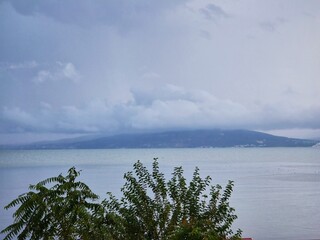 Calm bay with a foggy mountain