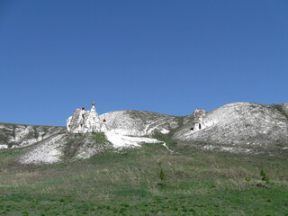 White chalk hills under clear blue sky in natural landscape  