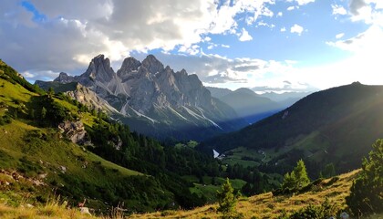 Obraz premium A vast mountain valley unfolds beneath a sky filled with fluffy clouds, bathed in the golden light of a serene afternoon.