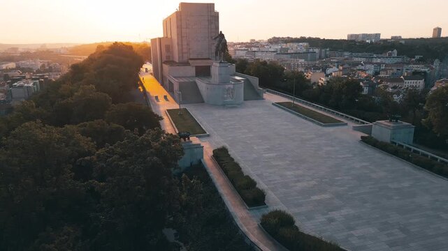 A tranquil morning unfolds at Vitkov Hill, showcasing the stunning National Monument dedicated to Jan Zizka. Witness the beauty of sunrise illuminating this historic site in Czechia.