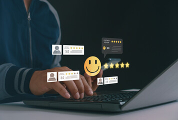 Customer hands typing on laptop with floating review icons, star ratings, and feedback symbols....