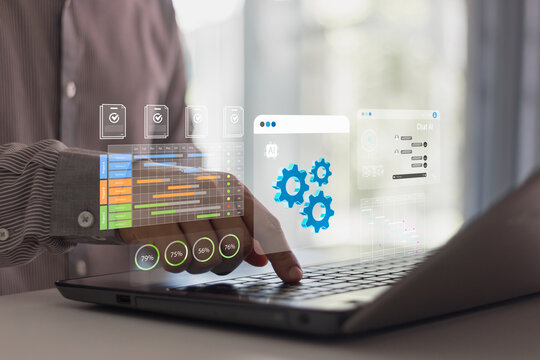 Businessman using laptop with digital dashboard interface showing AI automation, project management, data analytics and productivity charts for modern business technology solutions.
