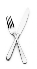 Elegant Silver Fork and Knife Crossed on a Pristine White Background, Offering a Clean and Modern Aesthetic for Culinary Themes and Table Setting Designs .