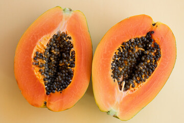 Juicy papaya fruit with seeds. Bright, orange juicy fruit in the bottom corner of the photo