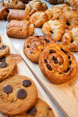 Chocolate biscuits, bagels, croissants, raisin rolls. French, Italian pastries.