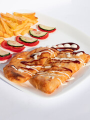 Fried Savory Pastry with French Fries and Fresh Vegetables on Plate