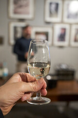 close-up of sommelier serving red wine at fine dining restaurant
