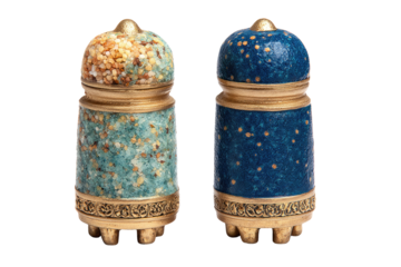 Two ornate, small containers with gold detailing and blue, teal speckled surfaces. background removed