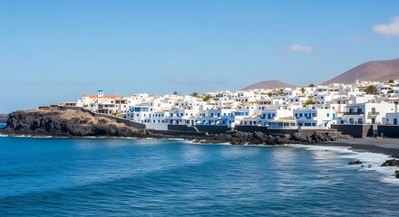 Fototapeta premium Picturesque Coastal Town with Whitewashed Buildings and Blue Sea.
