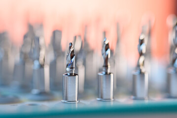 Full set of dental implant drill bits in surgical tray, close-up of professional dentistry equipment
