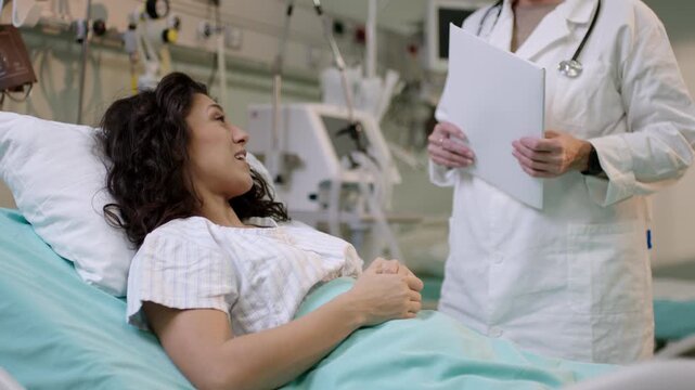 A doctor discusses a patient's condition in a hospital setting during a consultation.
